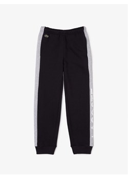 Lacoste Spodnie dresowe XJ5327 Czarny Regular Fit ze sklepu MODIVO w kategorii Spodnie chłopięce - zdjęcie 183639478