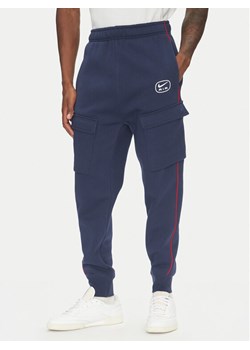 Nike Spodnie dresowe HM0180 Granatowy Regular Fit ze sklepu MODIVO w kategorii Spodnie męskie - zdjęcie 183652669