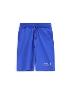 Coccodrillo Szorty sportowe WC5121501VBC Niebieski Regular Fit ze sklepu MODIVO w kategorii Spodenki chłopięce - zdjęcie 183683799