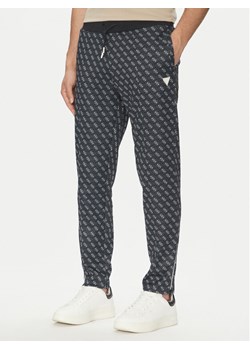 Guess Spodnie dresowe Korbin Z2BB05 FL04Q Czarny Regular Fit ze sklepu MODIVO w kategorii Spodnie męskie - zdjęcie 183765076