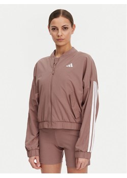 adidas Kurtka bomber Essentials 3-Stripes JD5318 Różowy Loose Fit ze sklepu MODIVO w kategorii Kurtki damskie - zdjęcie 183778367