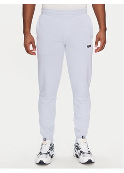 Puma Spodnie dresowe Ess 684714 Fioletowy Regular Fit ze sklepu MODIVO w kategorii Spodnie męskie - zdjęcie 183813229