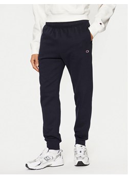 Champion Spodnie dresowe 220299 Granatowy Slim Fit ze sklepu MODIVO w kategorii Spodnie męskie - zdjęcie 183814887