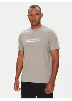 Calvin Klein T-Shirt Outline Tape Graphic LV04RC852G Szary Regular Fit ze sklepu MODIVO w kategorii T-shirty męskie - zdjęcie 183867265