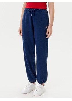 Guess Spodnie dresowe W5YB65 KCXQ1 Granatowy Regular Fit ze sklepu MODIVO w kategorii Spodnie damskie - zdjęcie 183874639