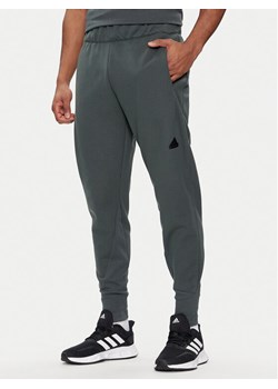 adidas Spodnie dresowe Z.N.E. Winterized IR5244 Zielony Regular Fit ze sklepu MODIVO w kategorii Spodnie męskie - zdjęcie 183885668
