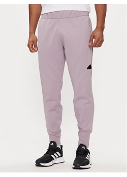 adidas Spodnie dresowe Z.N.E. Winterized IR5245 Fioletowy Regular Fit ze sklepu MODIVO w kategorii Spodnie męskie - zdjęcie 183885669