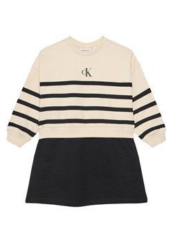 Calvin Klein Jeans Sukienka dzianinowa IG0IG02963 M Beżowy Relaxed Fit ze sklepu MODIVO w kategorii Sukienki dziewczęce - zdjęcie 183910655