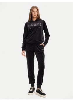 Guess Spodnie dresowe V3BB27 K0232 Czarny Regular Fit ze sklepu MODIVO w kategorii Spodnie damskie - zdjęcie 183938017