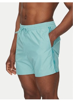 Calvin Klein Swimwear Szorty kąpielowe KM0KM01109 Błękitny Regular Fit ze sklepu MODIVO w kategorii Kąpielówki - zdjęcie 183938116