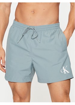 Calvin Klein Swimwear Szorty kąpielowe KM0KM01161 Błękitny Regular Fit ze sklepu MODIVO w kategorii Kąpielówki - zdjęcie 183938188