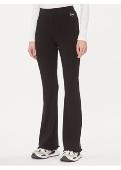 Tommy Jeans Spodnie materiałowe DW0DW17311 Czarny Flare Fit ze sklepu MODIVO w kategorii Spodnie damskie - zdjęcie 183945345