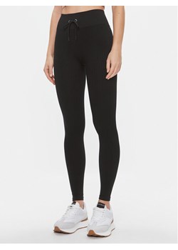 Guess Legginsy Rib-Seamless V4RB00 Z3CC0 Czarny Slim Fit ze sklepu MODIVO w kategorii Spodnie damskie - zdjęcie 183946395