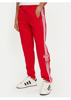 adidas Spodnie dresowe adicolor Classics Adibreak IM8221 Czerwony Regular Fit ze sklepu MODIVO w kategorii Spodnie męskie - zdjęcie 183946695