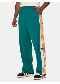 adidas Spodnie dresowe Adibreak IY9932 Turkusowy Loose Fit ze sklepu MODIVO w kategorii Spodnie męskie - zdjęcie 183947065