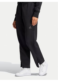 adidas Spodnie dresowe ALL SZN French Terry 3-Stripes JI9106 Czarny Loose Fit - id: 0000303900311 - marki adidas - 183947497 adidas Spodnie dresowe ALL SZN French Terry 3-Stripes JI9106 Czarny Loose Fit ze sklepu MODIVO w kategorii Spodnie damskie - zdjęcie 183947497
