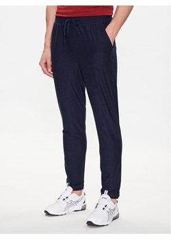 Skechers Spodnie dresowe Ultra Go Lite MPT108 Granatowy Tapered Fit ze sklepu MODIVO w kategorii Spodnie męskie - zdjęcie 183947939