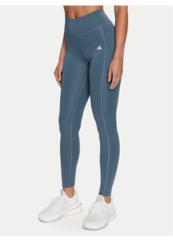 adidas Legginsy Optime IT9110 Niebieski Slim Fit ze sklepu MODIVO w kategorii Spodnie damskie - zdjęcie 183948579