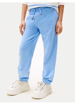 Tommy Hilfiger Spodnie dresowe KS0KS00596 Błękitny Regular Fit ze sklepu MODIVO w kategorii Spodnie chłopięce - zdjęcie 183985796