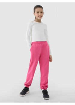 Dziewczęce spodnie dresowe joggery 4F 4FJWSS25TTROF0950 - różowe ze sklepu Sportstylestory.com w kategorii Spodnie dziewczęce - zdjęcie 184004528