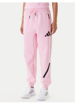 adidas Spodnie dresowe Z.N.E. JC5405 Różowy Regular Fit ze sklepu MODIVO w kategorii Spodnie damskie - zdjęcie 184007988