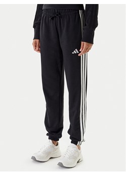 adidas Spodnie dresowe Essentials 3-Stripes JD5302 Czarny Regular Fit ze sklepu MODIVO w kategorii Spodnie damskie - zdjęcie 184019238