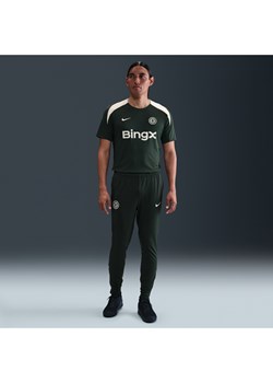 Męskie spodnie piłkarskie z dzianiny Nike Dri-FIT Chelsea F.C. Strike - Zieleń ze sklepu Nike poland w kategorii Spodnie męskie - zdjęcie 184044186