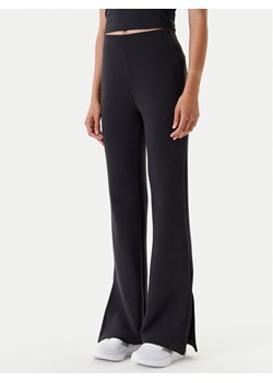 adidas Legginsy ALL SZN Soft Lux JM3757 Czarny Flared Fit ze sklepu MODIVO w kategorii Spodnie damskie - zdjęcie 184045799