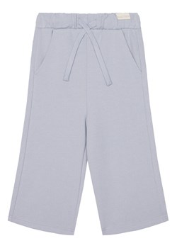 United Colors Of Benetton Spodnie dresowe 3UNIGF04P Niebieski Wide Leg ze sklepu MODIVO w kategorii Spodnie dziewczęce - zdjęcie 184098249