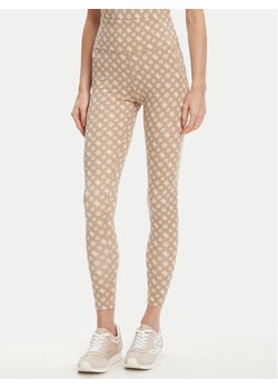 Guess Legginsy V5YB18 MC03W Beżowy Slim Fit ze sklepu MODIVO w kategorii Spodnie damskie - zdjęcie 184103338