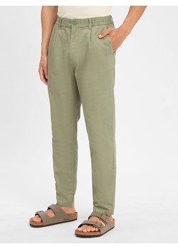 Tommy Jeans Chino - Isaac Mężczyźni Bawełna oliwkowy jednolity - id: 741934-0002-09900 - marki Tommy Jeans - 184182305 Tommy Jeans Chino - Isaac Mężczyźni Bawełna oliwkowy jednolity ze sklepu vangraaf w kategorii Spodnie męskie - zdjęcie 184182305