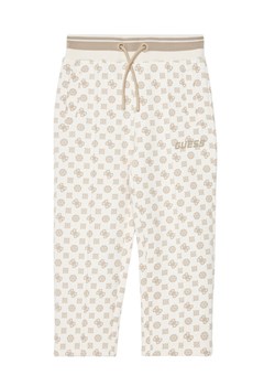Guess Spodnie dresowe J5YQ34 KB212 Écru Regular Fit ze sklepu MODIVO w kategorii Spodnie dziewczęce - zdjęcie 184193128
