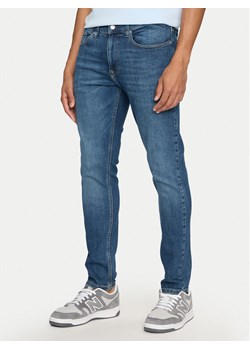 Tommy Jeans Jeansy Austin DM0DM20173 Niebieski Slim Fit ze sklepu MODIVO w kategorii Jeansy męskie - zdjęcie 184227969