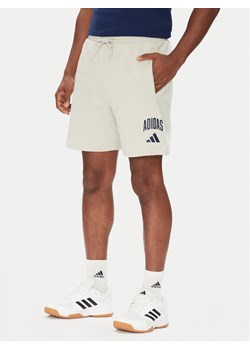 adidas Szorty sportowe Collegiate JM1726 Beżowy Regular Fit ze sklepu MODIVO w kategorii Spodenki męskie - zdjęcie 184231906