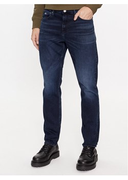 Tommy Jeans Jeansy Scanton DM0DM17438 Granatowy Slim Fit ze sklepu MODIVO w kategorii Jeansy męskie - zdjęcie 184250777