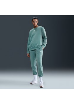 Damskie spodnie dresowe ze średnim stanem Nike Sportswear Phoenix Fleece - Zieleń ze sklepu Nike poland w kategorii Spodnie damskie - zdjęcie 184264488