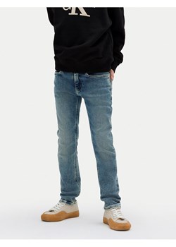 Calvin Klein Jeans Jeansy IB0IB02189 D Niebieski Slim Fit ze sklepu MODIVO w kategorii Spodnie chłopięce - zdjęcie 184282619