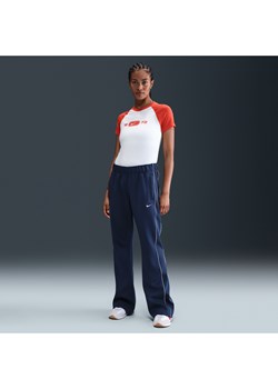 Damskie dopasowane spodnie z dzianiny ze średnim stanem Nike Sportswear Windrunner - Niebieski ze sklepu Nike poland w kategorii Spodnie damskie - zdjęcie 184284137