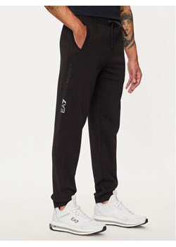 EA7 Emporio Armani Spodnie dresowe 6DPP58 PJVTZ 1200 Czarny Regular Fit ze sklepu MODIVO w kategorii Spodnie męskie - zdjęcie 184287928
