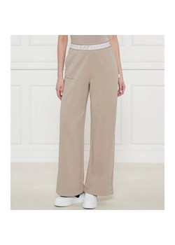 EA7 Spodnie dresowe | flare fit ze sklepu Gomez Fashion Store w kategorii Spodnie damskie - zdjęcie 184505077