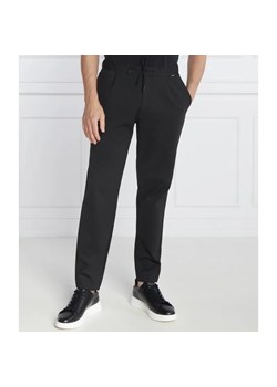 Calvin Klein Spodnie dresowe COMFORT KNIT PLEAT | Tapered fit ze sklepu Gomez Fashion Store w kategorii Spodnie męskie - zdjęcie 184509018