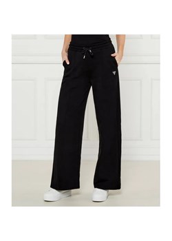 GUESS ACTIVE Spodnie dresowe PRIMULA | flare fit ze sklepu Gomez Fashion Store w kategorii Spodnie damskie - zdjęcie 184509635