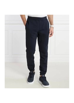 Tommy Hilfiger Spodnie dresowe GLOBAL STRIPE | Regular Fit ze sklepu Gomez Fashion Store w kategorii Spodnie męskie - zdjęcie 184509726