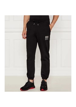 HUGO Spodnie dresowe Dusplitan | Loose fit ze sklepu Gomez Fashion Store w kategorii Spodnie męskie - zdjęcie 184516417