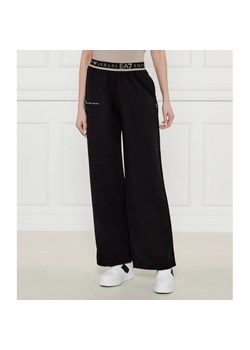 EA7 Spodnie dresowe | flare fit ze sklepu Gomez Fashion Store w kategorii Spodnie damskie - zdjęcie 184517428