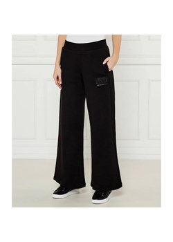 EA7 Spodnie dresowe | flare fit ze sklepu Gomez Fashion Store w kategorii Spodnie damskie - zdjęcie 184519976