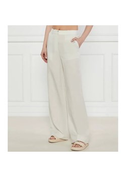 Calvin Klein Spodnie | flare fit | z dodatkiem lnu ze sklepu Gomez Fashion Store w kategorii Spodnie damskie - zdjęcie 184520849