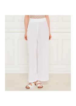 Guess Spodnie NOEMI | flare fit ze sklepu Gomez Fashion Store w kategorii Spodnie damskie - zdjęcie 184521999