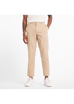 Spodnie męskie New Balance MP43554SOT – beżowe ze sklepu New Balance Poland w kategorii Spodnie męskie - zdjęcie 184542316