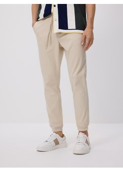 Reserved - Spodnie jogger slim - kremowy ze sklepu Reserved w kategorii Spodnie męskie - zdjęcie 184584397